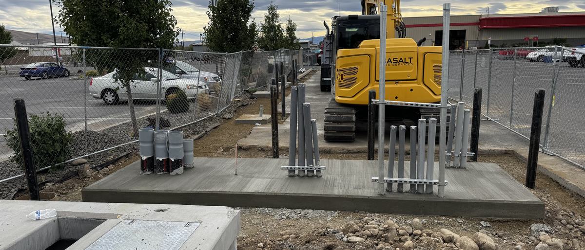 Completed EV charging stations with bollard protection at a retail site in Yakima
