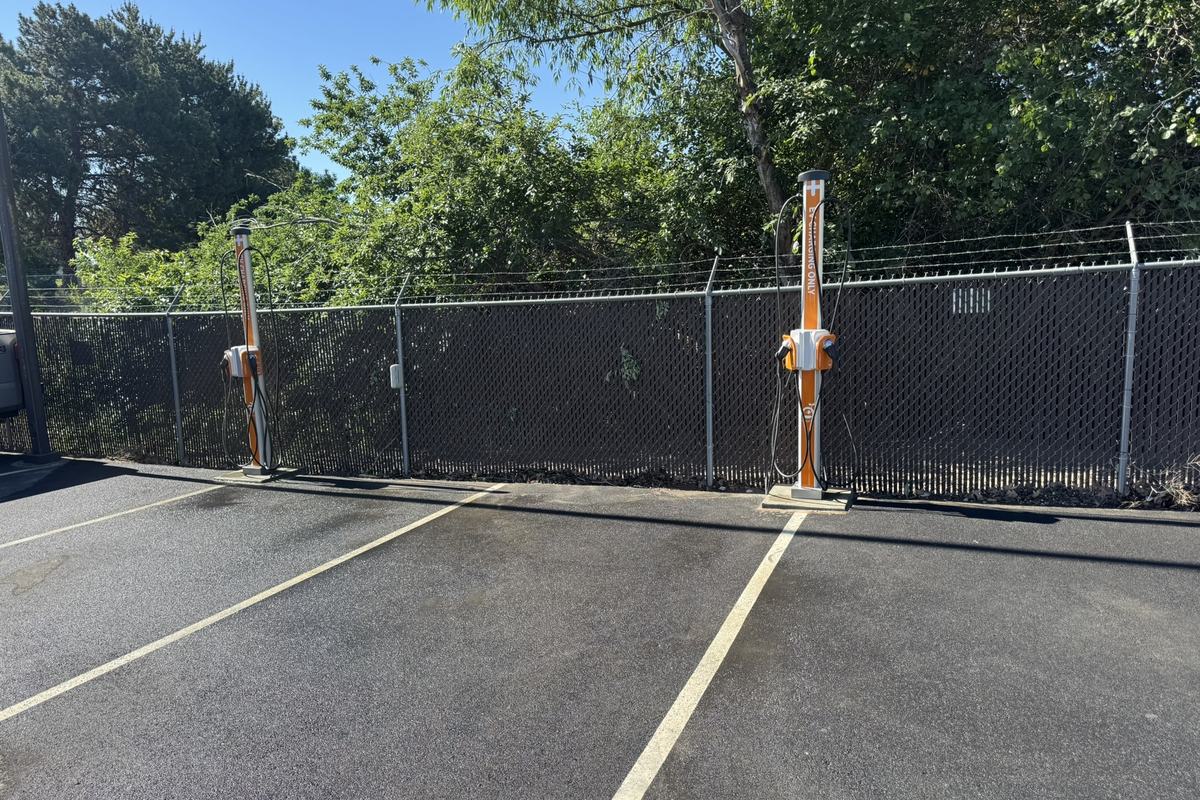 Completed EV charging stalls with bollards and fresh striping